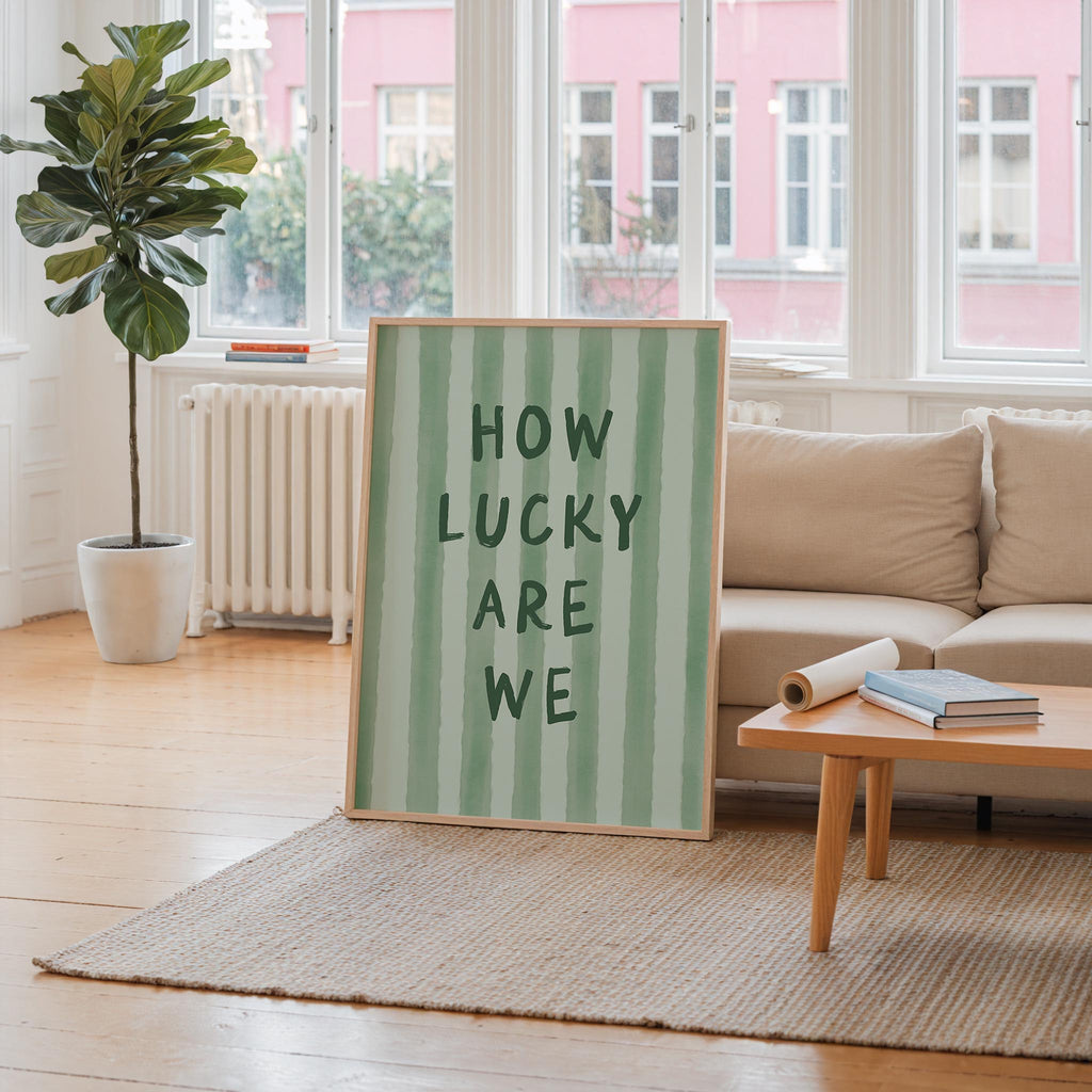 a large green and white striped sign with the text "HOW LUCKY ARE WE" displayed prominently in the center of the room.