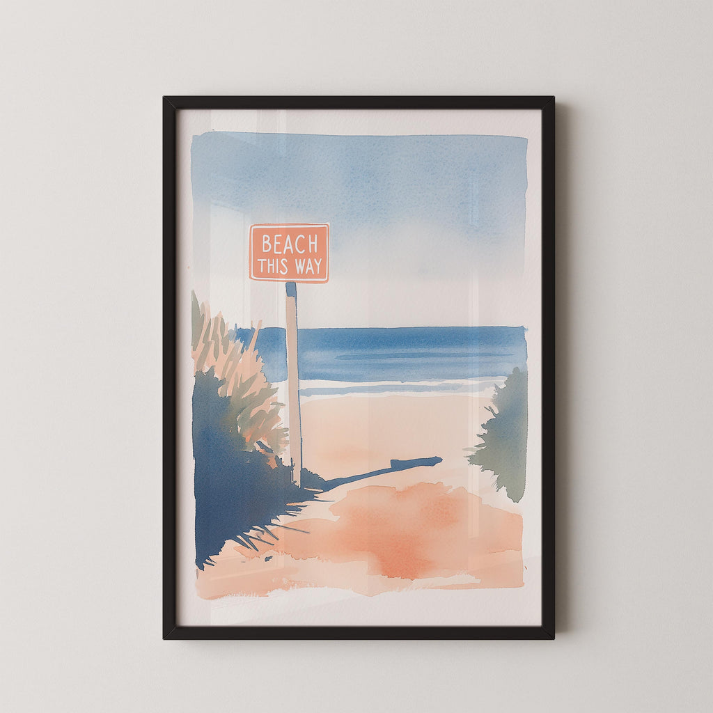 The image is a framed watercolor painting depicting a beach scene with a sign that says "BEACH THIS WAY".