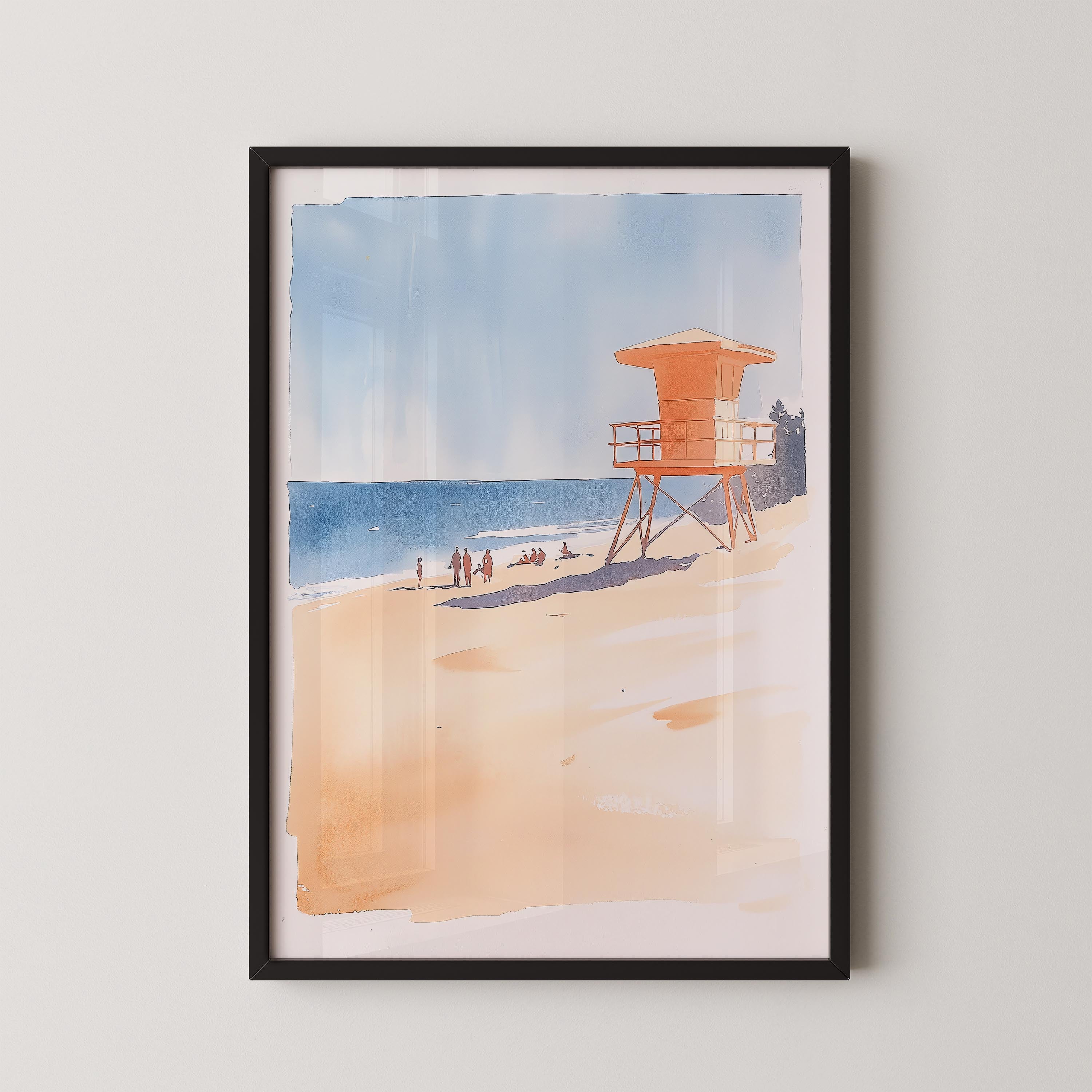 A framed watercolor painting depicting a lifeguard tower on a beach with people enjoying the ocean.