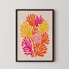 The image is a framed artwork depicting a vibrant, abstract floral design with various shades of orange, pink, and yellow.