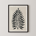 a framed print of a stylized leaf design in black and white.