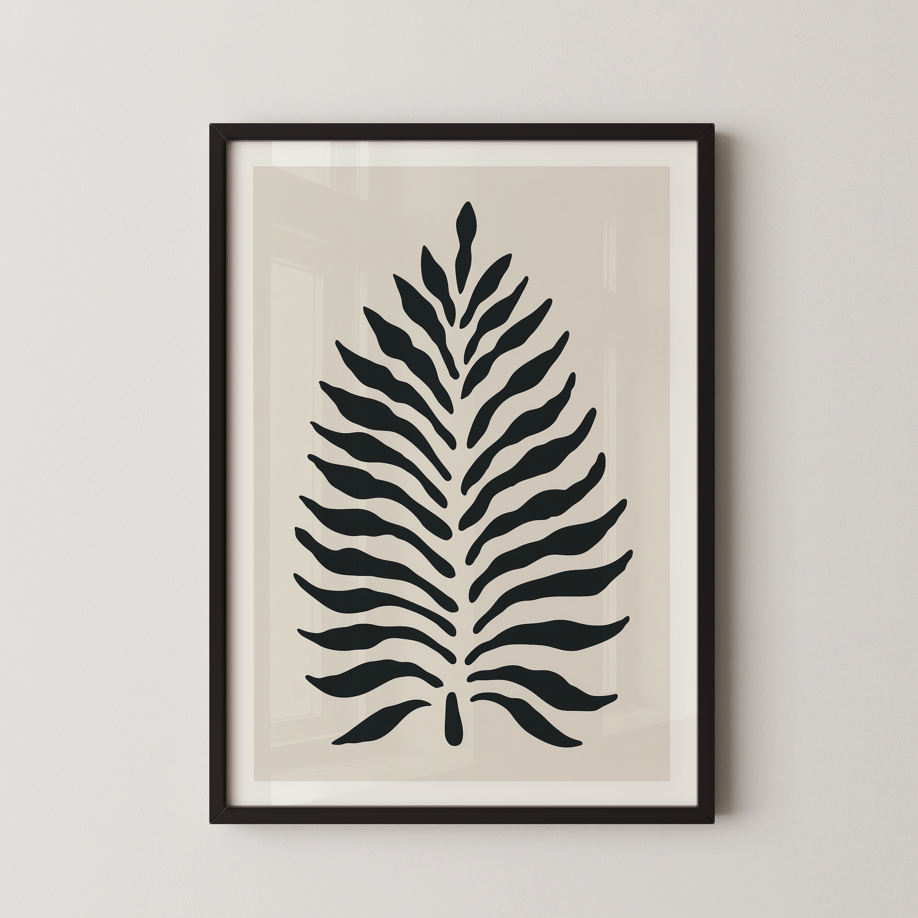a framed print of a stylized leaf design in black and white.