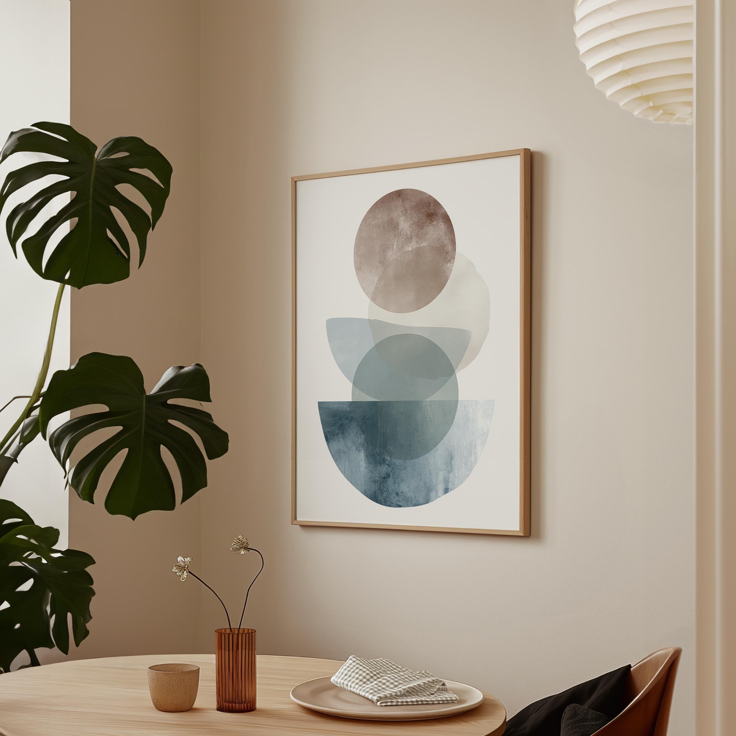 a minimalist dining area with a wooden table, a vase with flowers, and a framed abstract art piece hanging on the wall.