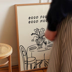 a person standing next to a framed poster with a table and chairs depicted on it.