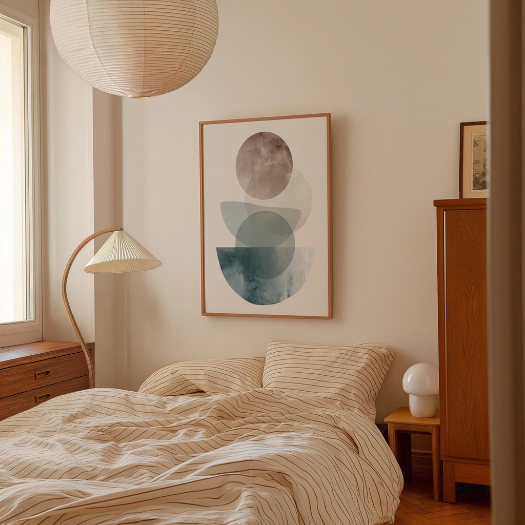 a cozy bedroom with a large bed, a wooden dresser, and a lamp. The room has a minimalist and modern design, with a large abstract painting hanging on the wall above the bed.