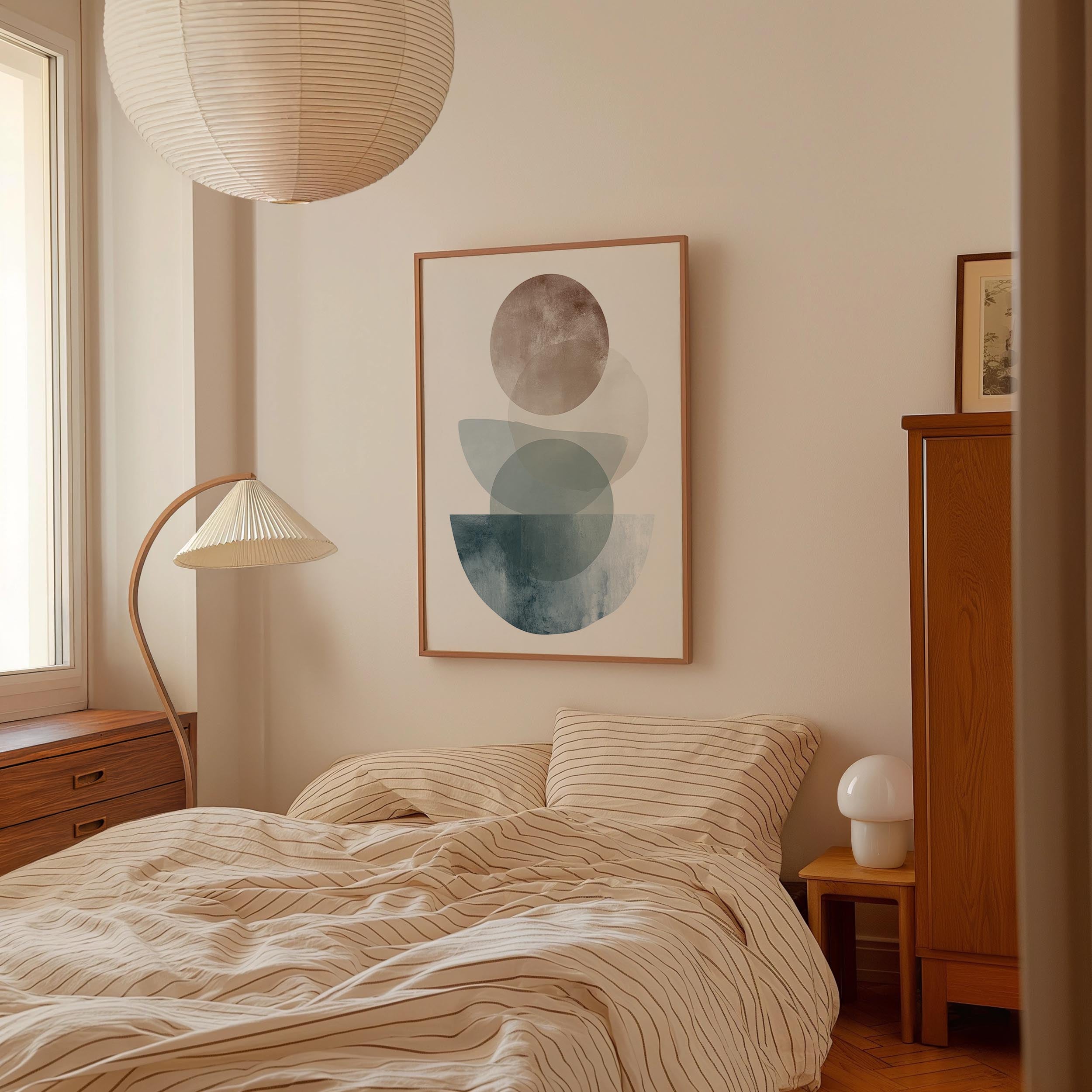 a cozy bedroom with a large bed, a wooden dresser, and a lamp. The room has a minimalist and modern design, with a large abstract painting hanging on the wall above the bed.