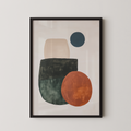 The image is a framed abstract art piece featuring a combination of geometric shapes and colors, including a large orange circle, a green rectangle, and a blue circle.