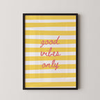 a framed poster with a yellow and white striped background and the text "good vibes only" written in pink cursive font.