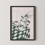 A framed illustration depicting a hand pouring coffee from a coffee pot into two cups on a checkered tablecloth.