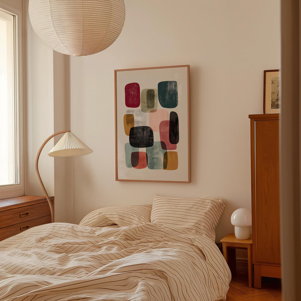 a cozy bedroom with a large bed, a wooden dresser, and a lamp. The room has a minimalist and modern design, with a large abstract painting hanging on the wall above the bed.