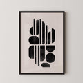 The image is a framed abstract art print featuring a minimalist design with geometric shapes and lines in black and white.