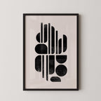 The image is a framed abstract art print featuring a minimalist design with geometric shapes and lines in black and white.