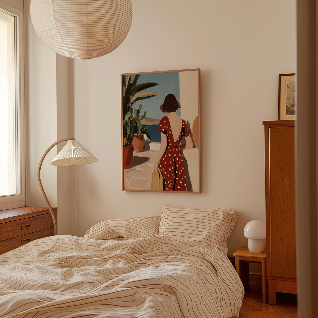 a bedroom with a bed, a lamp, and a painting on the wall.