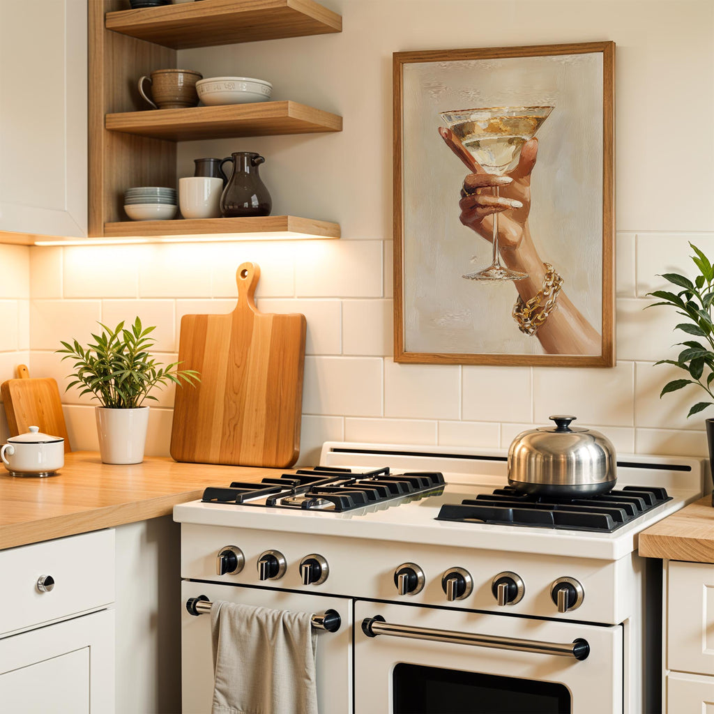 a cozy kitchen scene with a white stove, wooden cutting board, and a framed picture of a hand holding a martini glass. The kitchen features white cabinets, a tile backsplash, and a potted plant, creating a warm and inviting atmosphere.