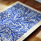 a close-up view of a piece of paper with a blue and white floral pattern.