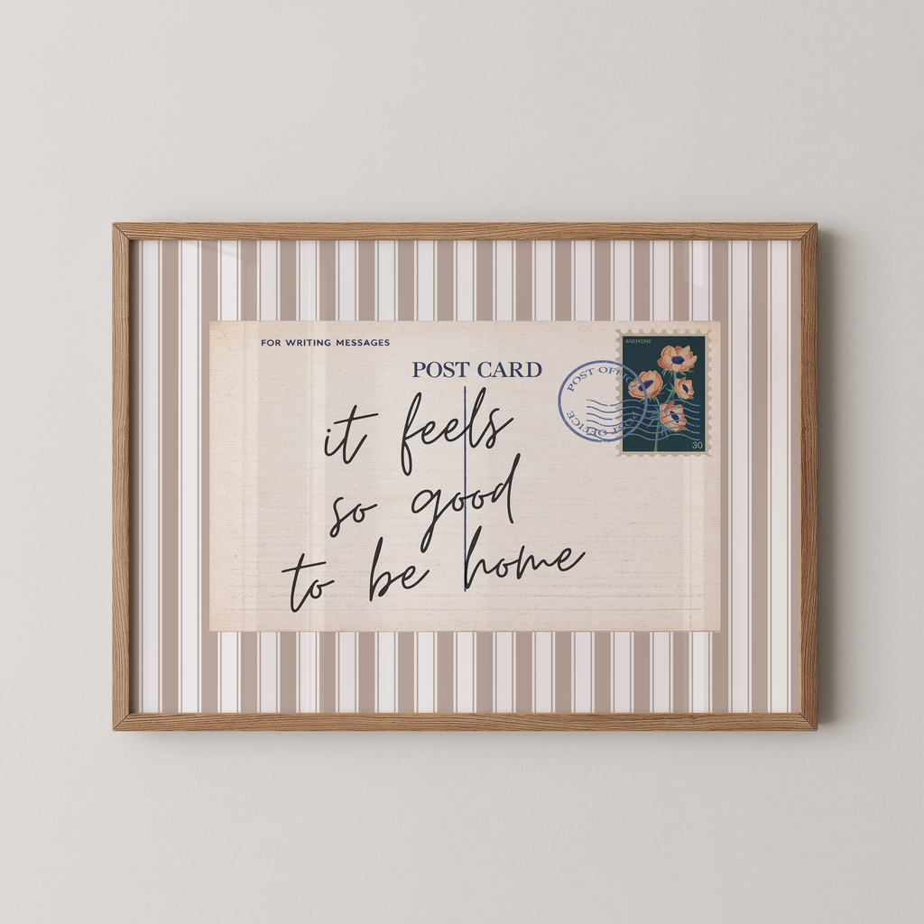 The image is a framed print with a postcard-like design, featuring a handwritten message and a postage stamp.