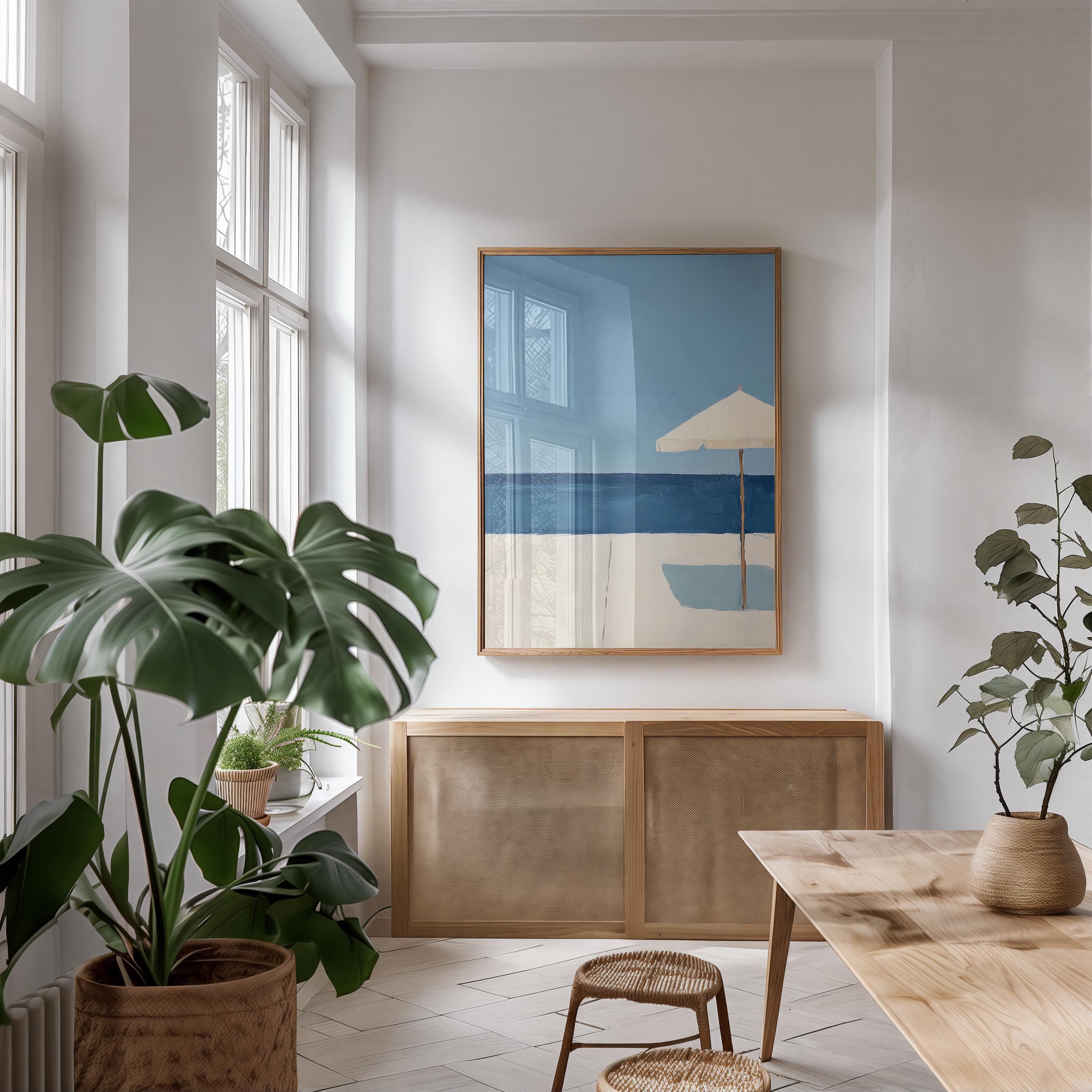a serene and modern living space with a large window, a wooden cabinet, and a framed artwork of a beach scene.