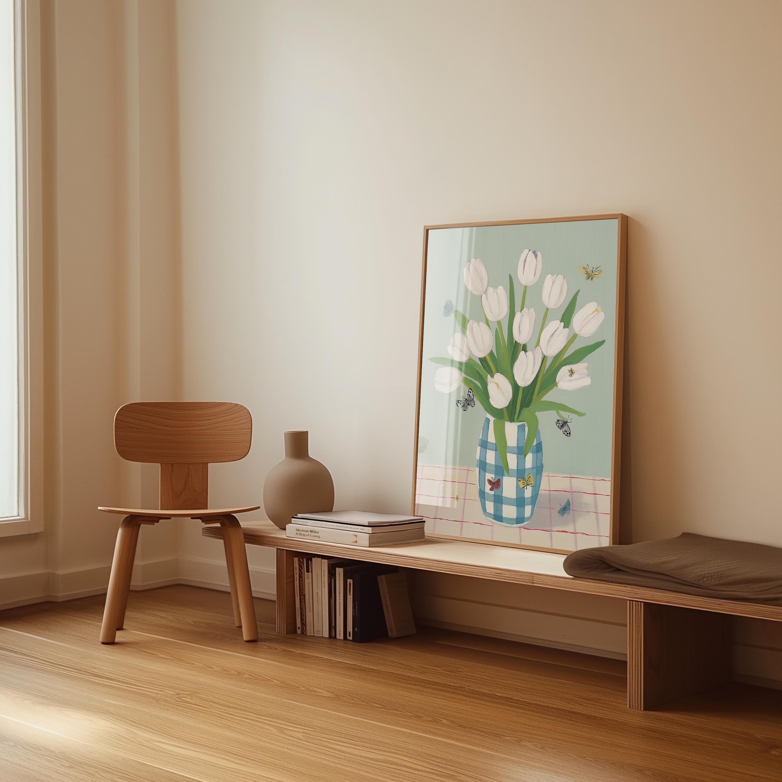 a wooden chair, a wooden bench, a vase, and a framed picture of white tulips on a table.