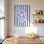 a kitchen counter with a bowl of lemons, a framed picture of a seahorse and starfish, and a shelf with jars and containers.