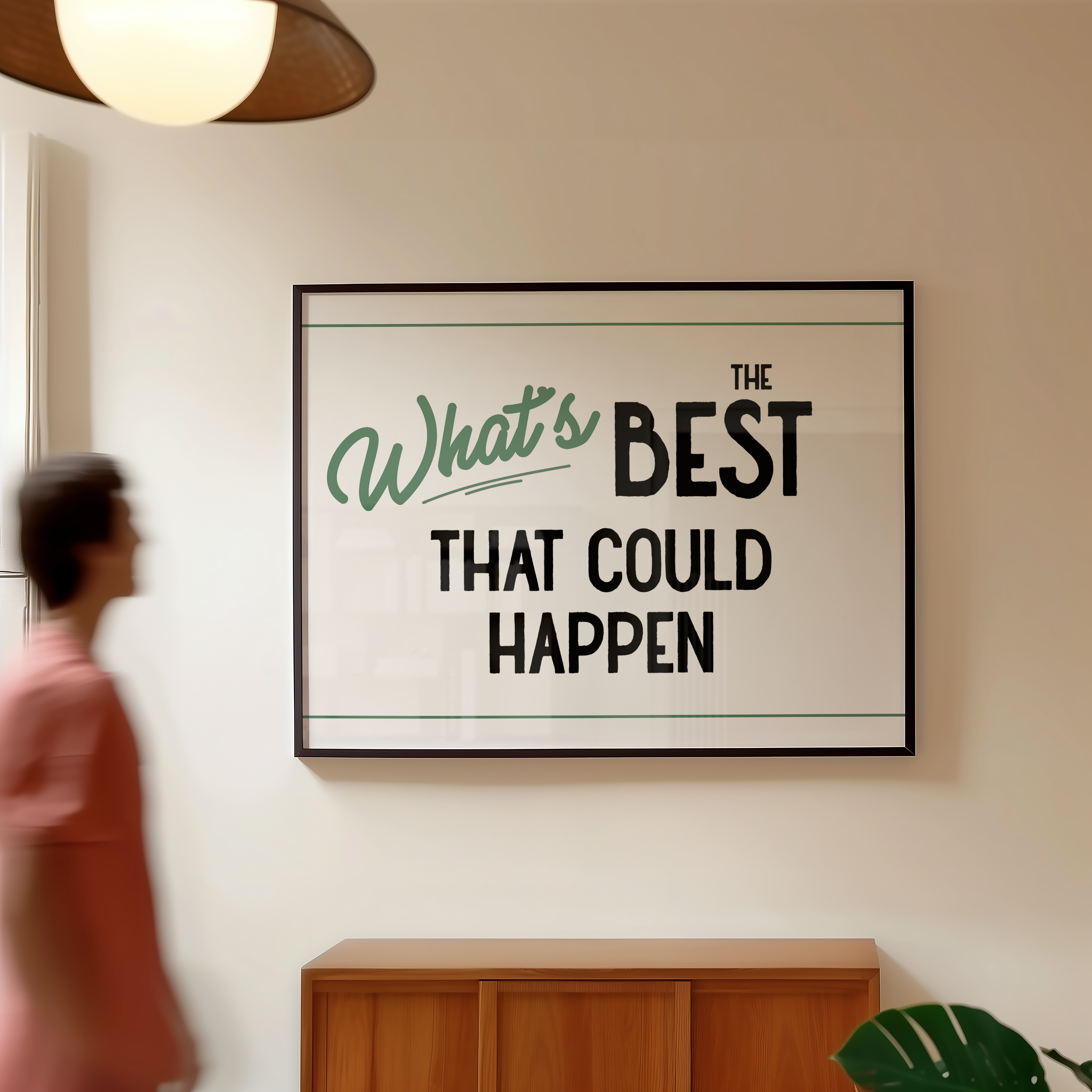 a framed poster with the text "What's BEST THAT COULD HAPPEN" hanging on a wall.