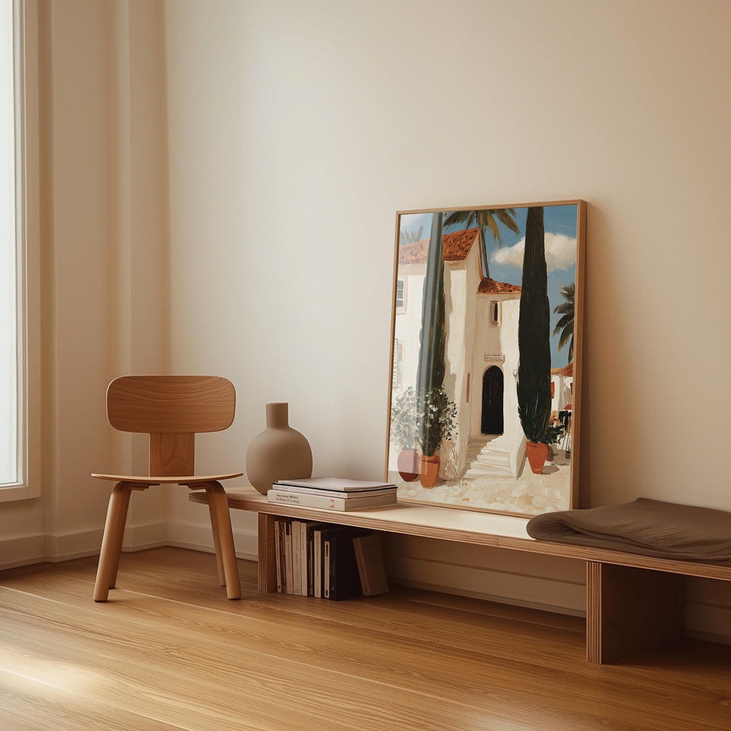 a wooden chair, a wooden bench, a vase, and a framed painting of a building with a palm tree.