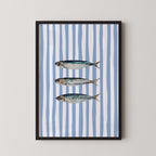 three fish swimming against a blue and white striped background.