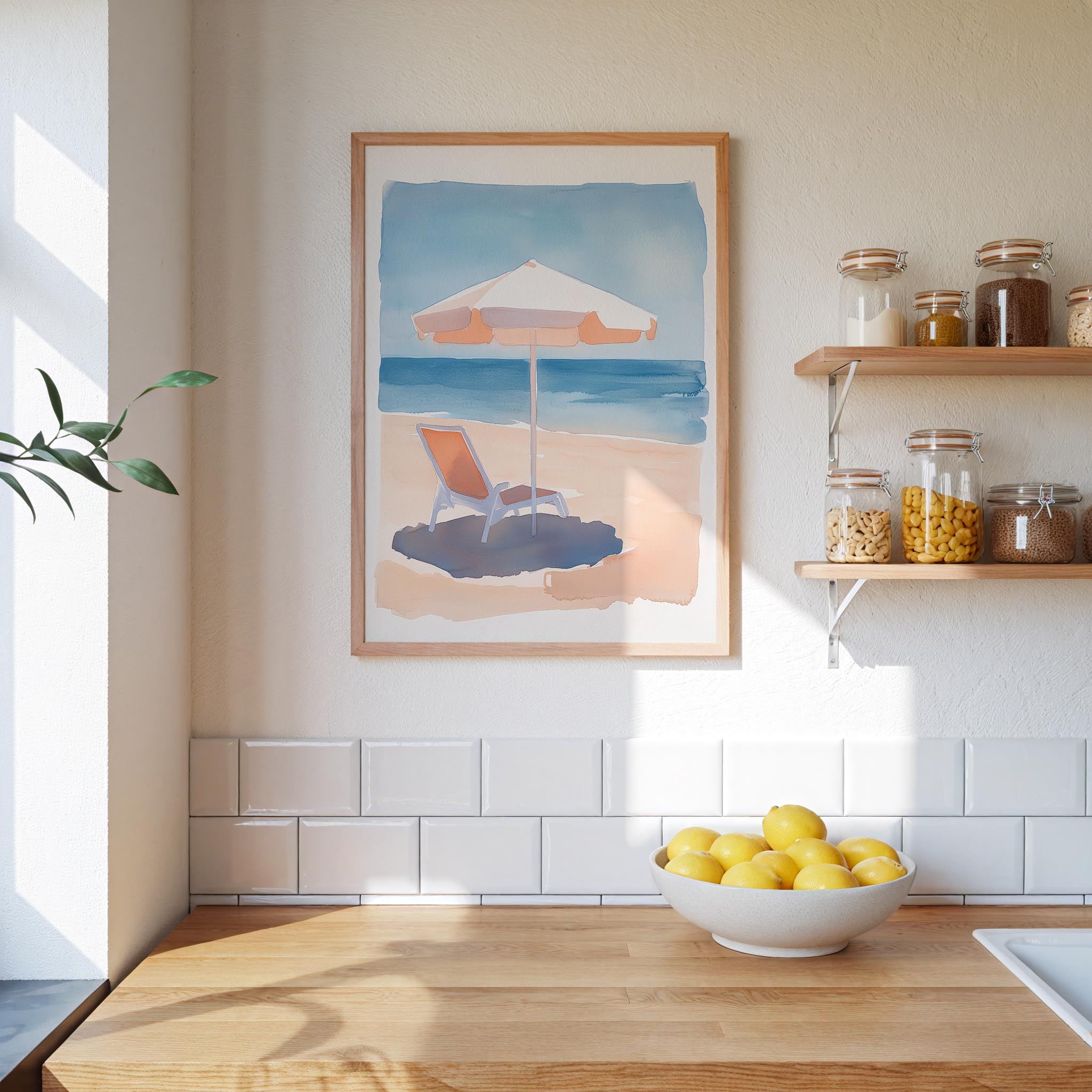 a kitchen counter with a bowl of lemons, a framed painting of a beach scene, and a shelf with jars and containers.