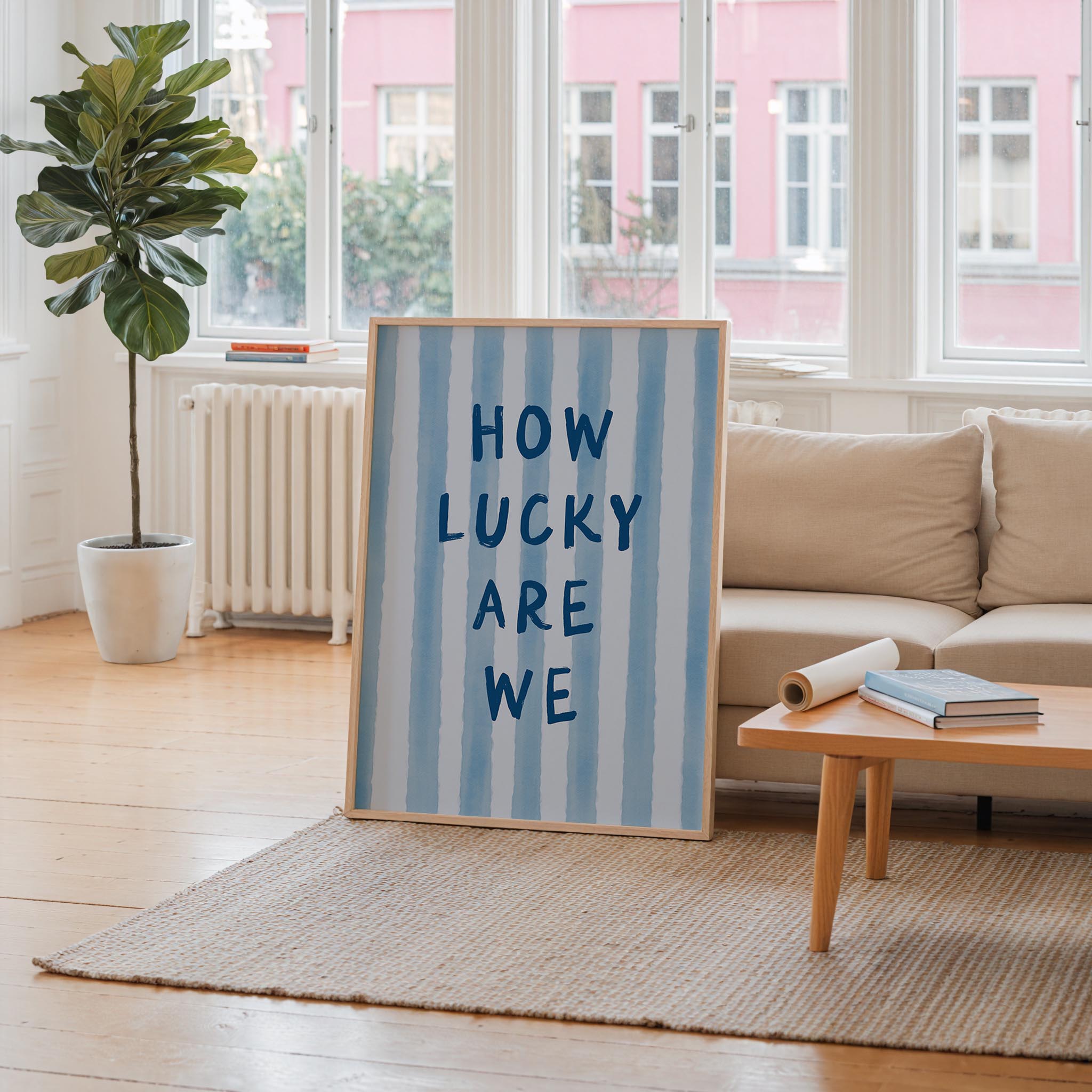 a large blue and white striped sign with the text "HOW LUCKY ARE WE" displayed prominently in the center of the room.
