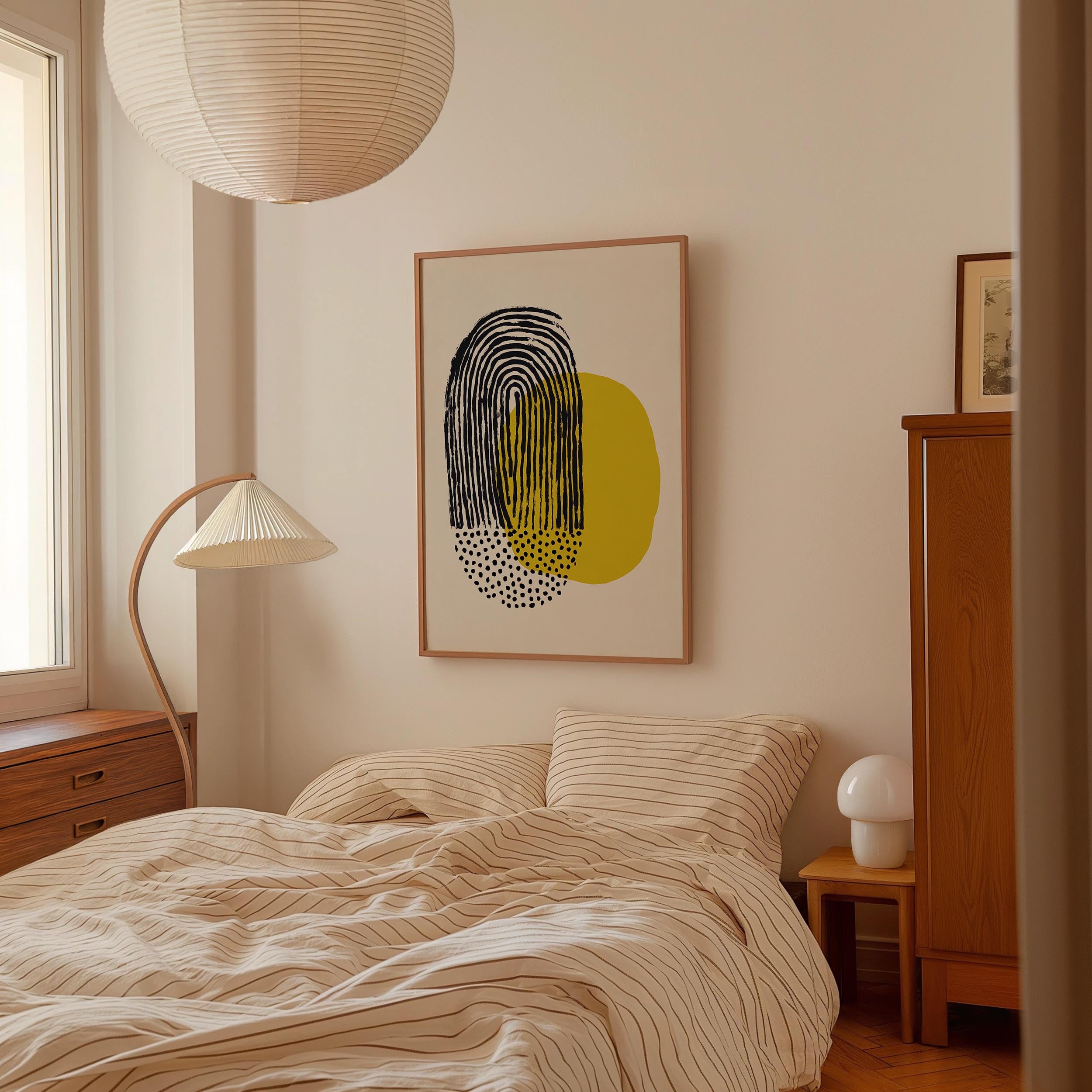 a cozy bedroom with a large bed, a wooden dresser, and a lamp. The room has a minimalist and modern design, with a large abstract painting hanging on the wall above the bed.