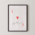 The image is a framed print with a red heart and the text "How lucky are we?" written on it.
