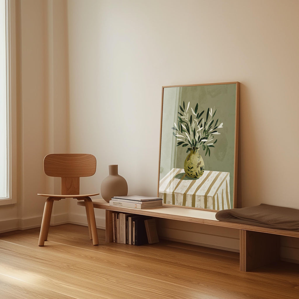 a minimalist interior design with a wooden chair, a wooden bench, a vase, and a framed painting of a plant on a table.