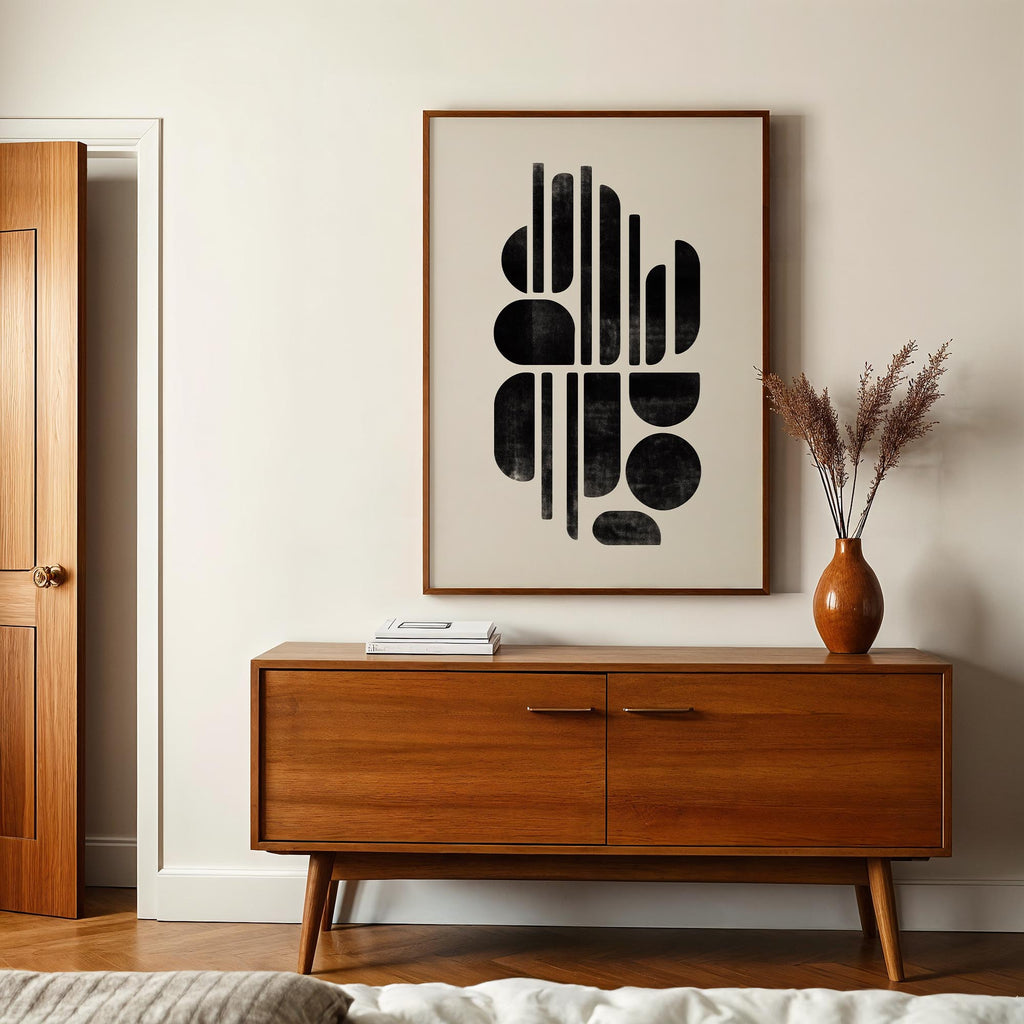 a modern interior design with a wooden cabinet, a framed abstract artwork, and a vase with dried flowers on a table.