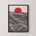 The image is a framed artwork depicting a red sun in the sky over a black and white wave pattern.