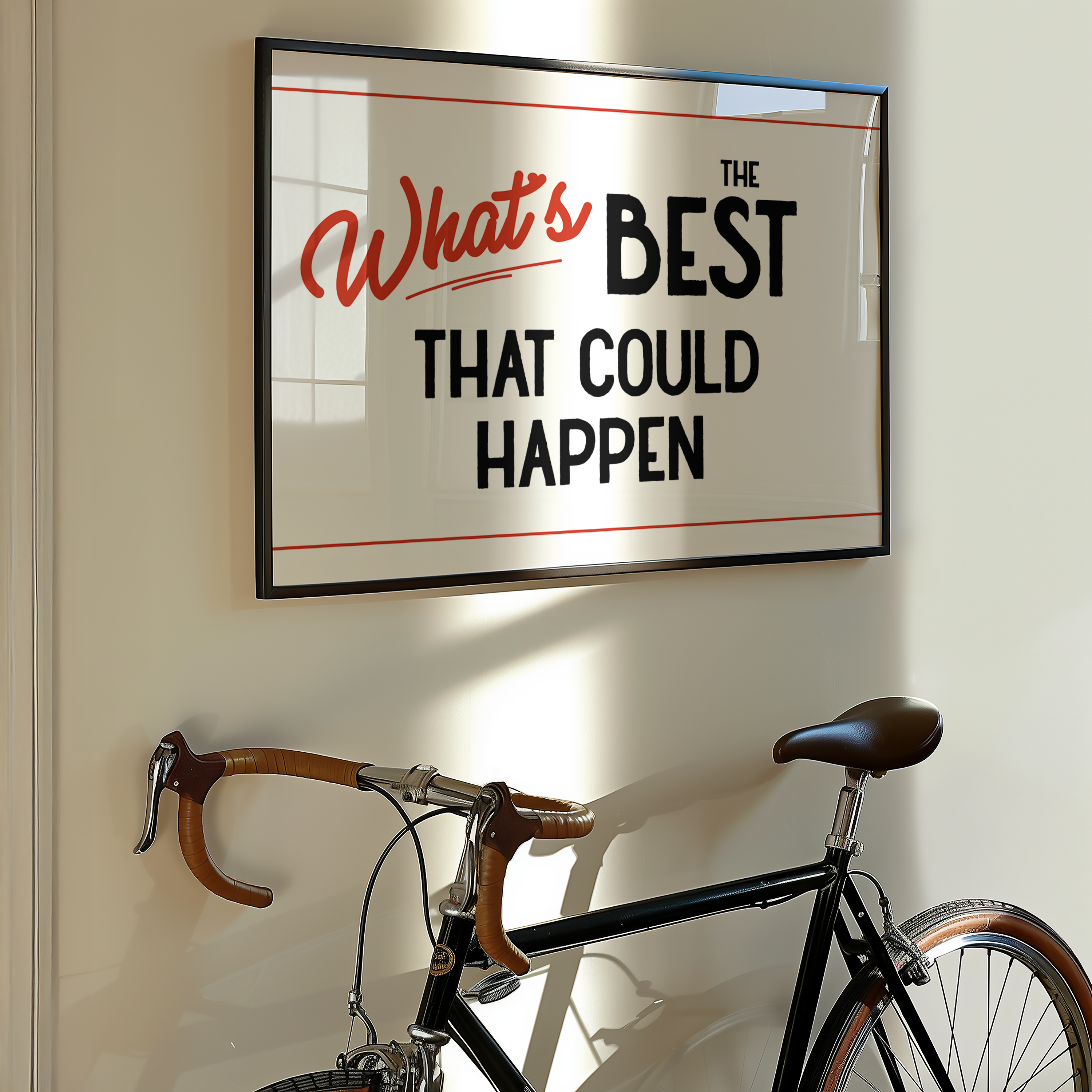 a framed motivational quote that says "What's BEST THAT COULD HAPPEN" on a wall, with a bicycle leaning against the wall below it.