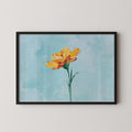 A framed painting of a single yellow flower against a light blue background.