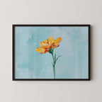 A framed painting of a single yellow flower against a light blue background.