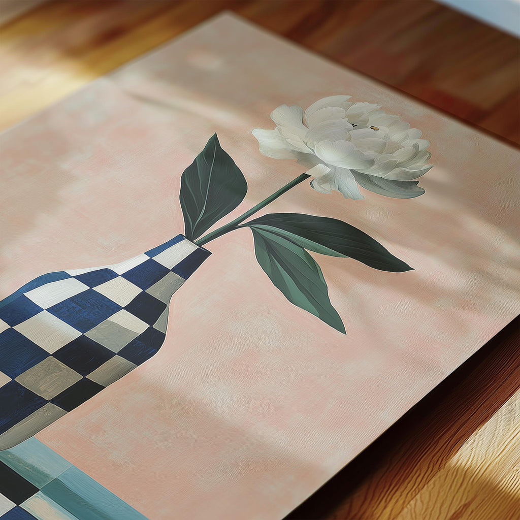 A white flower in a blue and white checkered vase is the central focus of the image.