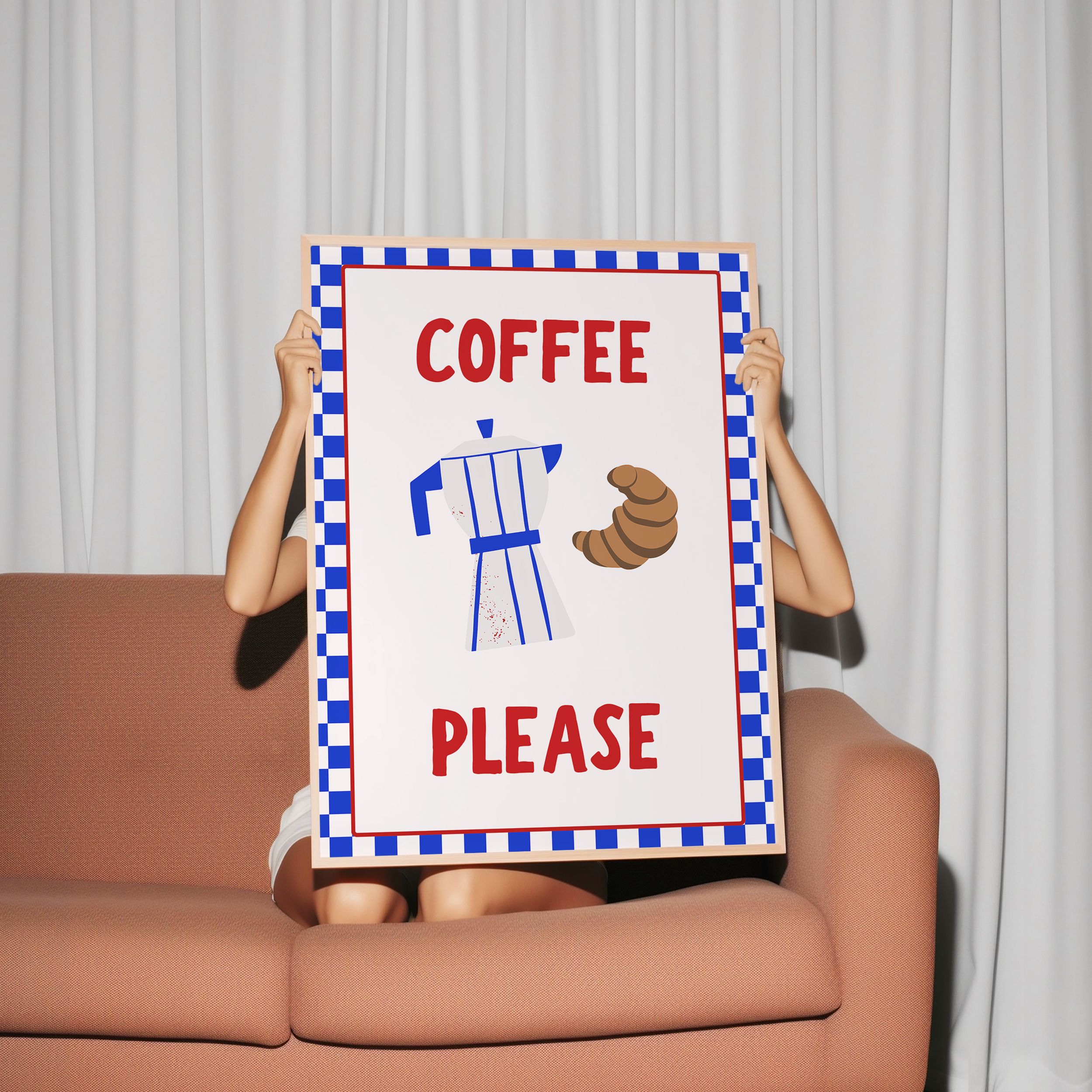 A person is sitting on a couch holding a sign that says "COFFEE PLEASE".