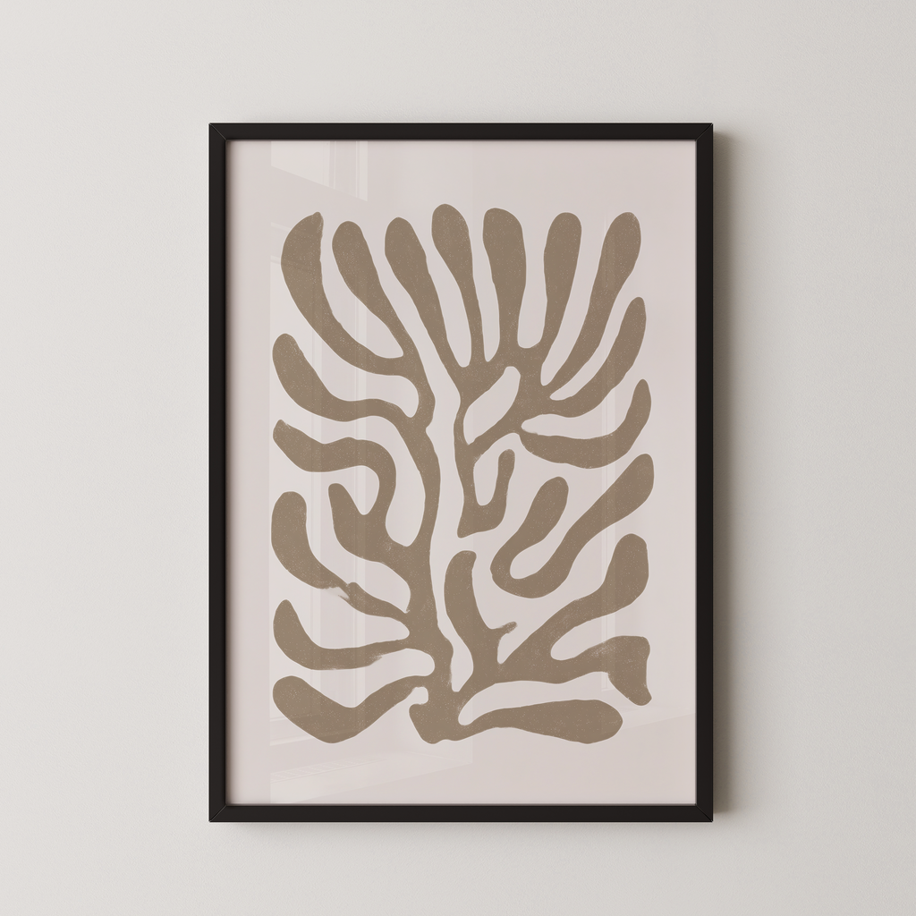 a framed abstract art print with a stylized tree-like design in shades of brown and beige.