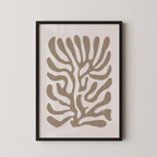 a framed abstract art print with a stylized tree-like design in shades of brown and beige.