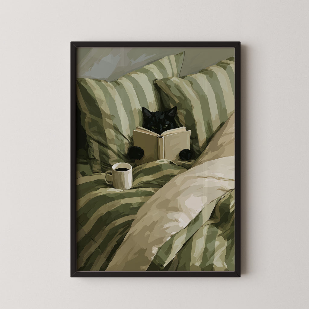 A black cat is lying in bed, reading a book while holding a cup of coffee.