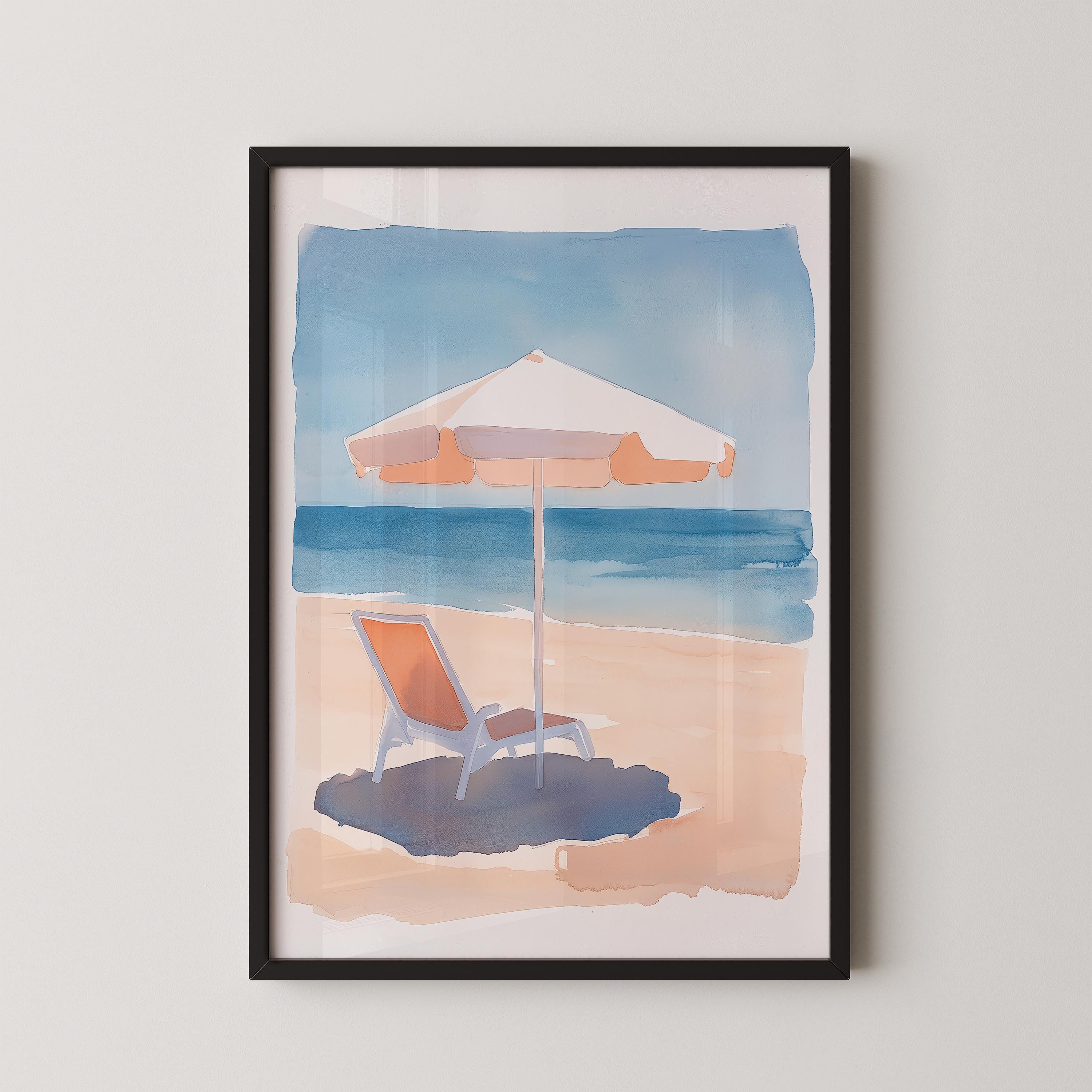 A framed watercolor painting depicting a beach scene with a beach chair under an umbrella, set against a backdrop of the ocean.