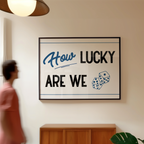 A person is walking past a framed sign that reads "How Lucky Are We" with dice graphics.