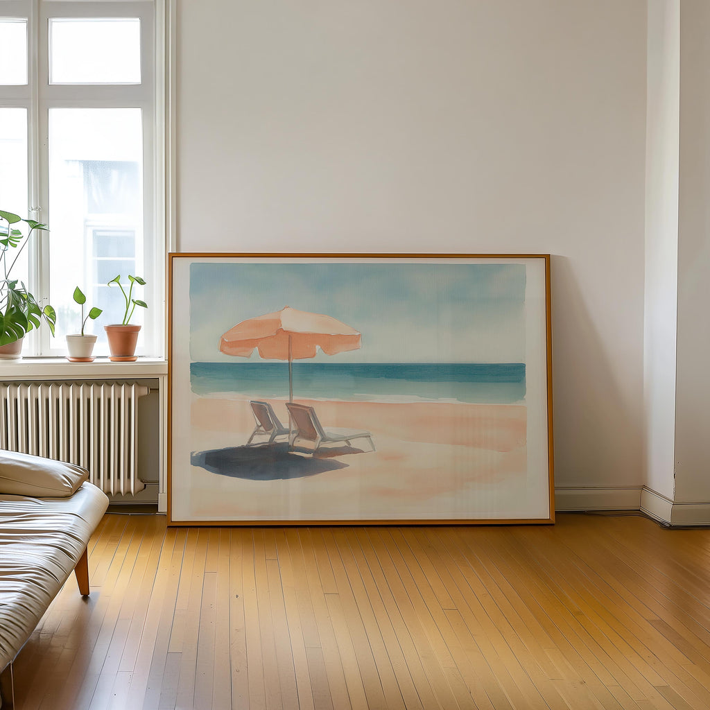 a large painting of a beach scene with a beach umbrella and two lounge chairs, set against a serene blue sky and ocean backdrop.