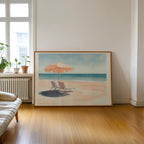 a large painting of a beach scene with a beach umbrella and two lounge chairs, set against a serene blue sky and ocean backdrop.