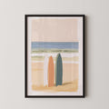 The image is a framed painting depicting two surfboards standing on a beach, with a serene ocean scene in the background.