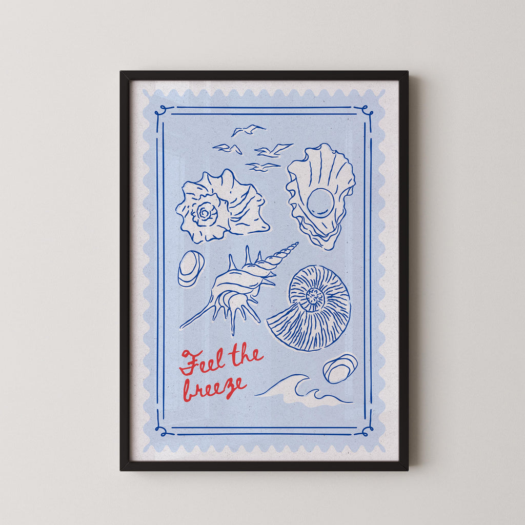 The image is a framed print featuring various sea-themed illustrations, including shells, a conch shell, and a seashell, along with the text "Feel the breeze" written in red.