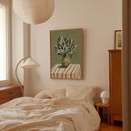 a cozy bedroom with a bed, a lamp, and a framed artwork on the wall.