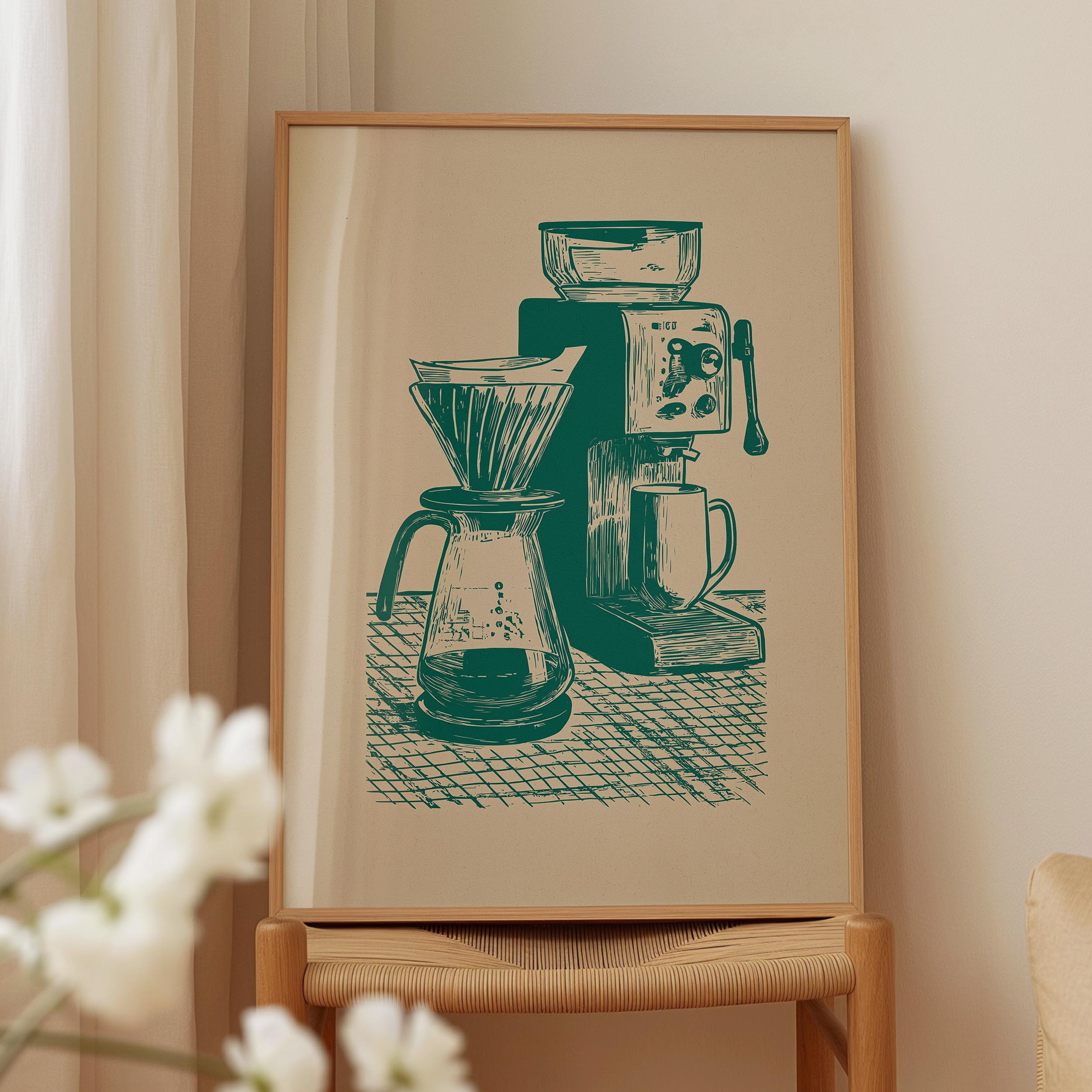 a framed illustration of a coffee maker and a coffee grinder on a table.