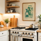 a cozy kitchen scene with a white gas range, wooden cutting board, and various kitchen accessories such as a coffee maker and a plant.